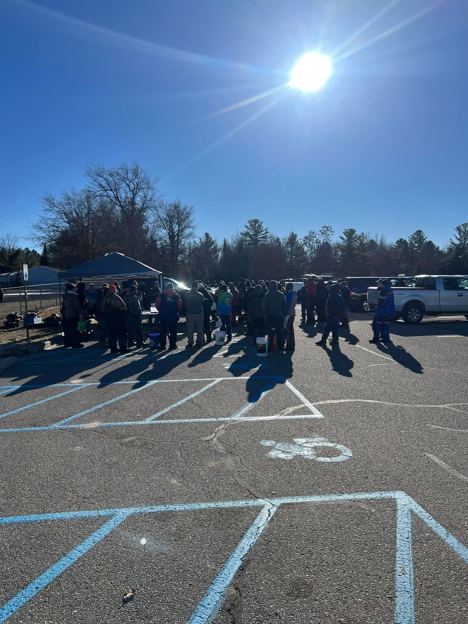 Angler catching fish on ice